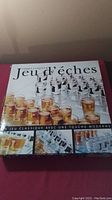 Original box of Chess Drinking Game showing the French title 'Jeu d'éches' with images of the chess board and shot glasses