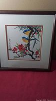 Full view of framed Chinese watercolour painting showing birds and blossoms