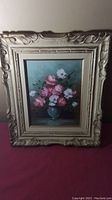 Full view of the original floral oil painting with ornate carved frame, showing overall condition and style.