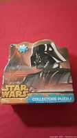 Front of Star Wars puzzle tin featuring Darth Vader image and 1000 piece count