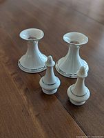 Pair of white ceramic candle holders and matching salt & pepper shakers from Lenox Regency Collection with platinum trim.