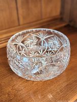 Side angle view of the vintage crystal bowl showing detailed cut patterns and thick crystal walls.