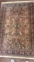 Full view of the entire rectangular area rug showing the overall design and colors