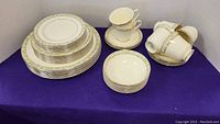 Photo of stacked dinner plates, side plates, lunch plates illustrating the pattern and size of plates