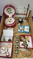 Overall view of entire jewelry lot laid out in box