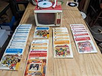 GE Show n' Tell unit and all included educational sets laid out on table