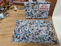 Complete assembled puzzle featuring a collage of 1983 Boston Red Sox baseball cards with puzzle box behind it.