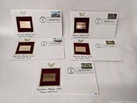 Five first day cover envelopes with mounted stamps and plaques representing legendary baseball stadiums, arranged overlapping each other.