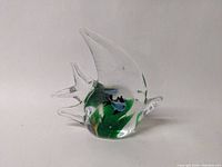 Angled front view of glass angelfish figurine showing the blue smaller fish and green internal glass details.