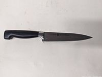 Full view of the 6-inch chef's knife showing the blade and black handle