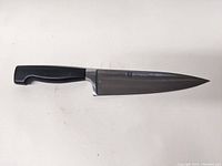 Full view of the chef's knife showing blade and handle.