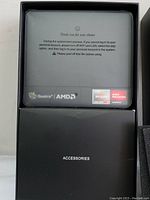 Overhead view of mini PC module and accessories box inside original packaging