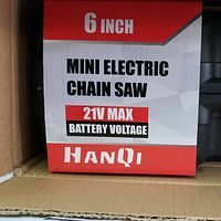 Close-up image of the box showing the text '6 Inch Mini Electric Chain Saw 21V Max Battery Voltage HANQI'.