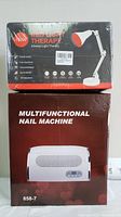 Both new items in original packaging: multifunctional nail machine and red light therapy lamp stacked side by side.