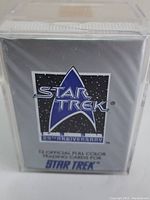 Front of the sealed box showing Star Trek 25th Anniversary logo with text about 12 official full-color trading cards.