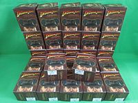 27 Indiana Jones Vinylmation Series One boxes arranged in rows showing lot quantity and condition.