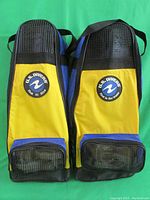 Pair of yellow and blue U.S. Divers fins showing logos and design from top view