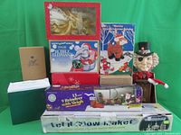 Full view of all boxed and loose Christmas decorations as listed, showing original packaging and varied sizes.