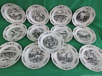 Complete top-down view of all 13 vintage Wedgwood Bicentennial plates arranged to display individual historical illustrations from each of the original 13 colonies.