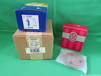 Boxed Hummel figurine and Marie Osmond mini wreath boxed items with protective packaging