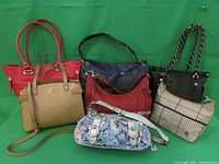Group photo of six shoulder bags of various brands and styles on a green background for lot overview.