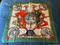 Full view of scarf laid flat showing overall design and green border