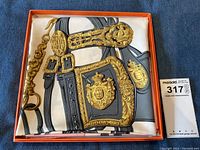 Scarf folded in original orange Hermès box with MaxSold tag