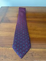 Tie laid flat showing full length and geometric pattern