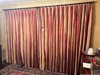 Wide view of hung curtains on rod