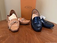 Both pairs of Tod's driving shoes and the orange Tod's box displayed together