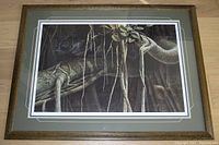 Framed limited edition print showing a black panther in a banyan tree setting, resting on a wooden floor.
