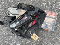 Biscuit cutter tool in black tool bag with label 'Biscuit Cutter' alongside a plastic organizer containing assorted wooden biscuits.