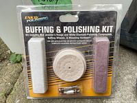 Photo of unopened Enkay Buffing & Polishing Kit including two buffing wheels, two polishing bars, and mounting hardware in plastic packaging.