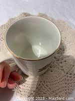 Interior and gold rim detail of one Jubilee mug showing glaze crazing