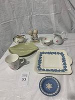 Full set of Wedgwood, Spode, and Limoges ceramic items including plates, cups, and figurines