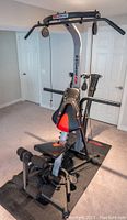 Full view of BowFlex Xtreme SE home gym installed on protective mat