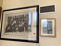 Both framed pieces on wall, showing overall arrangement and size contrast