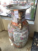 Front view showing overall shape, painted panels and flared rim