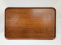 Top-down view of the rectangular teak tray showing the wood grain and surface condition.