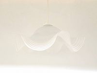 Front view of the white frosted glass pendant light with ruffled wavy edges and a smooth dome center hanging from wire.