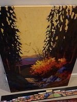 Canvas print leaning against wall with panels laid out at its base