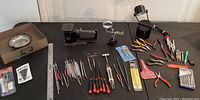 Full overview of all precision hobby tools including screwdrivers, pliers, cutters, magnetic dish, scales, and magnifying glass with clips