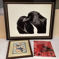 Frontal view of all three bird art pieces together on a table