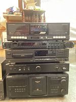 Side view of Dynaco preamplifier on top of Technics receiver