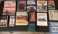 Photo showing full collection of 14 books on strategic use of railroads and trains in various wars.