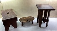 Overview photo of the three wooden stools showing size and design differences