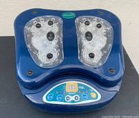 Blue Life Force LF007 foot massager showing top view of device with clear plastic foot pads and control panel.