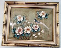 Framed floral artwork with bird and white and pink roses, bamboo-style gold frame
