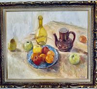 Framed oil painting depicting fruit still life with apples, oranges, brown teapot, and bottle on cloth, signed 'Compr' visible in corner.