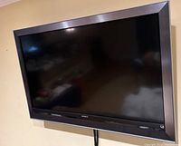 Front view of Sony 52-inch TV mounted on wall